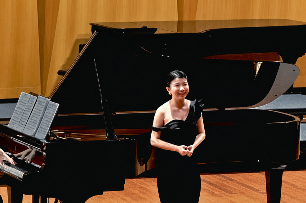 Olivia performing on stage.